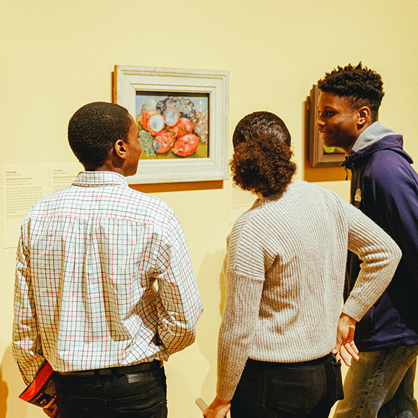 Beacon Academy Students looking at artwork in a museum